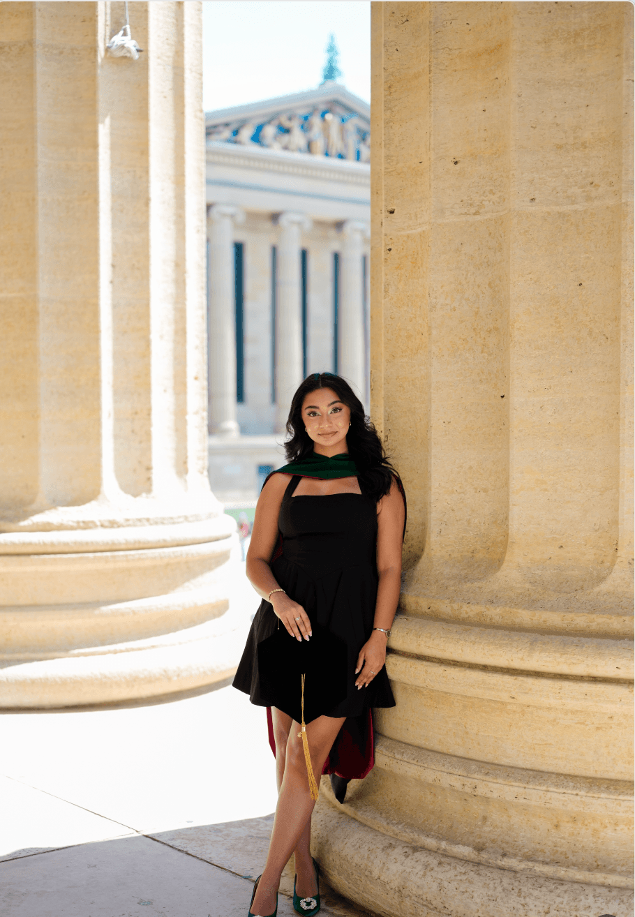 A graduate at the columns